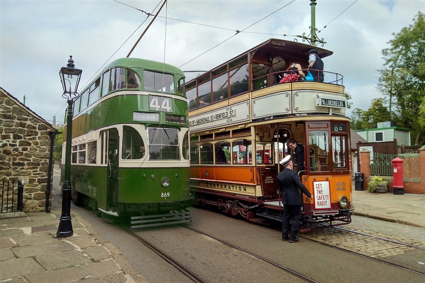 Liverpool and Glasgow tram side by side at Crich Tramway Museum